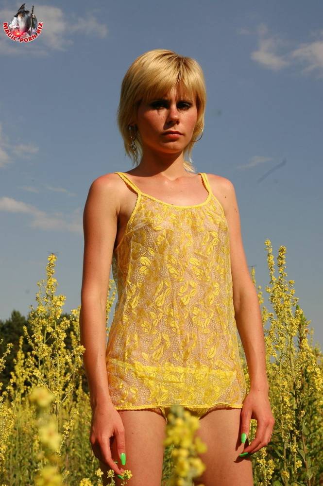 Young looking blonde girl shows her skinny body amid blooming wild flowers - #5