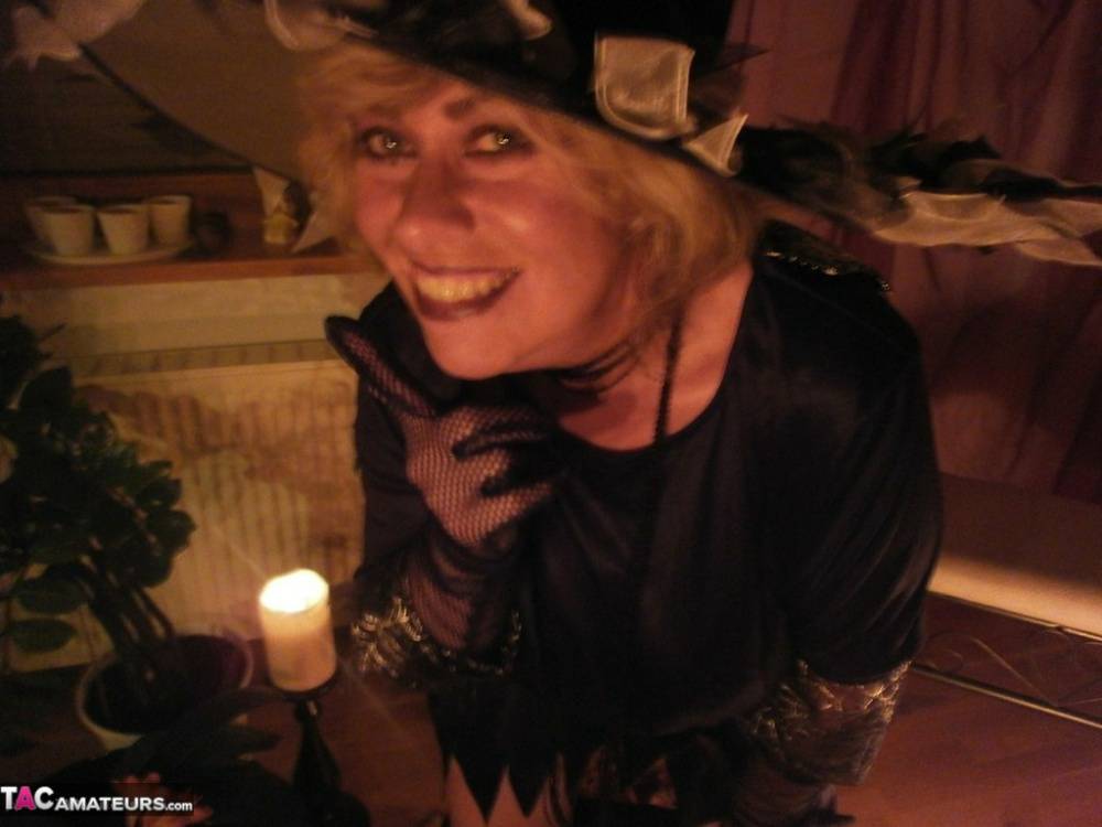 Wild mature witch Caro sticking a fat dildo up her juicy twat for a Halloween - #16