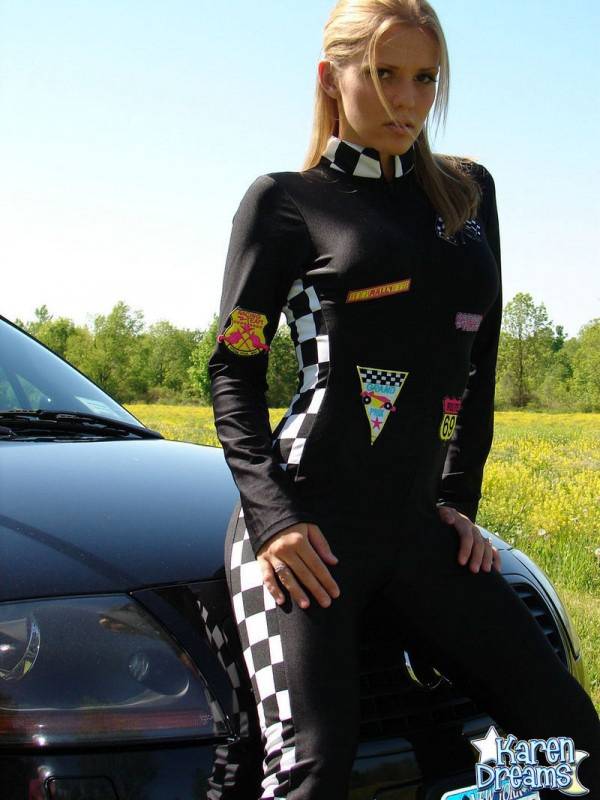 Amateur girl Karen shows some side boob in a racing suit atop a car - #11