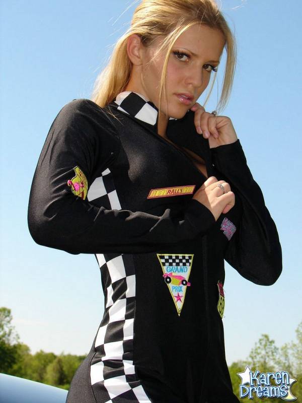 Amateur girl Karen shows some side boob in a racing suit atop a car - #7