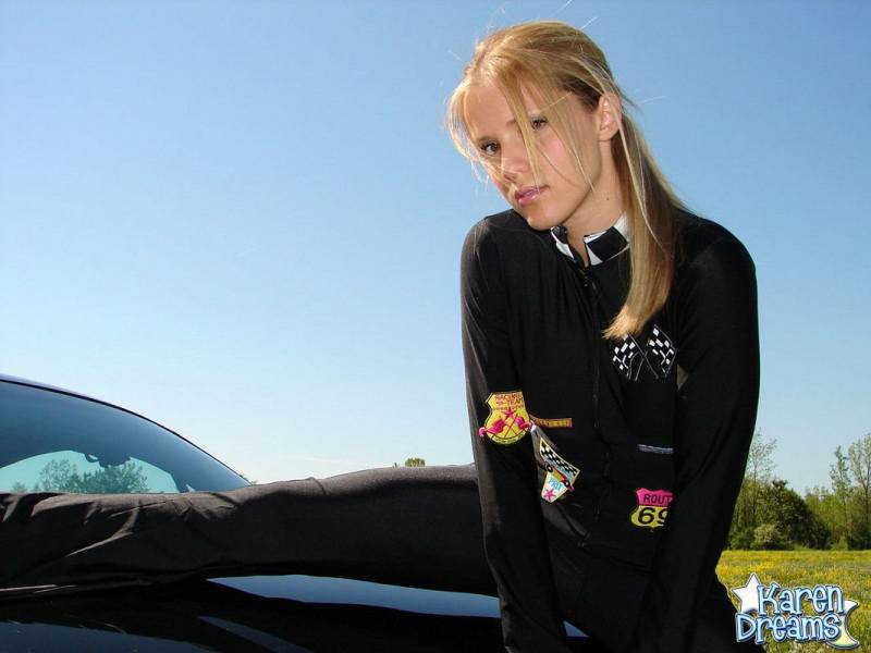 Amateur girl Karen shows some side boob in a racing suit atop a car - #9