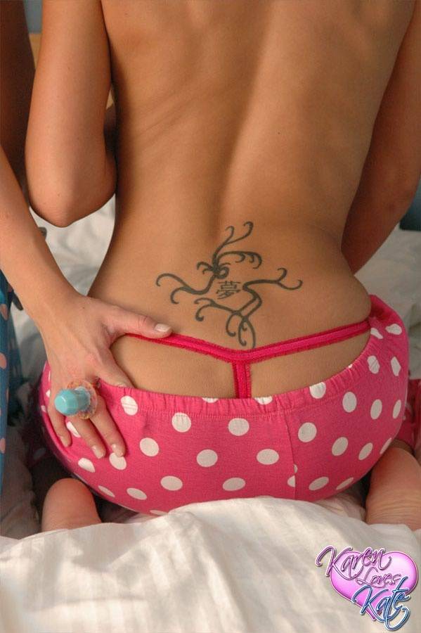 Young lesbians stack thong clad asses while topless on a bed in pigtails - #9