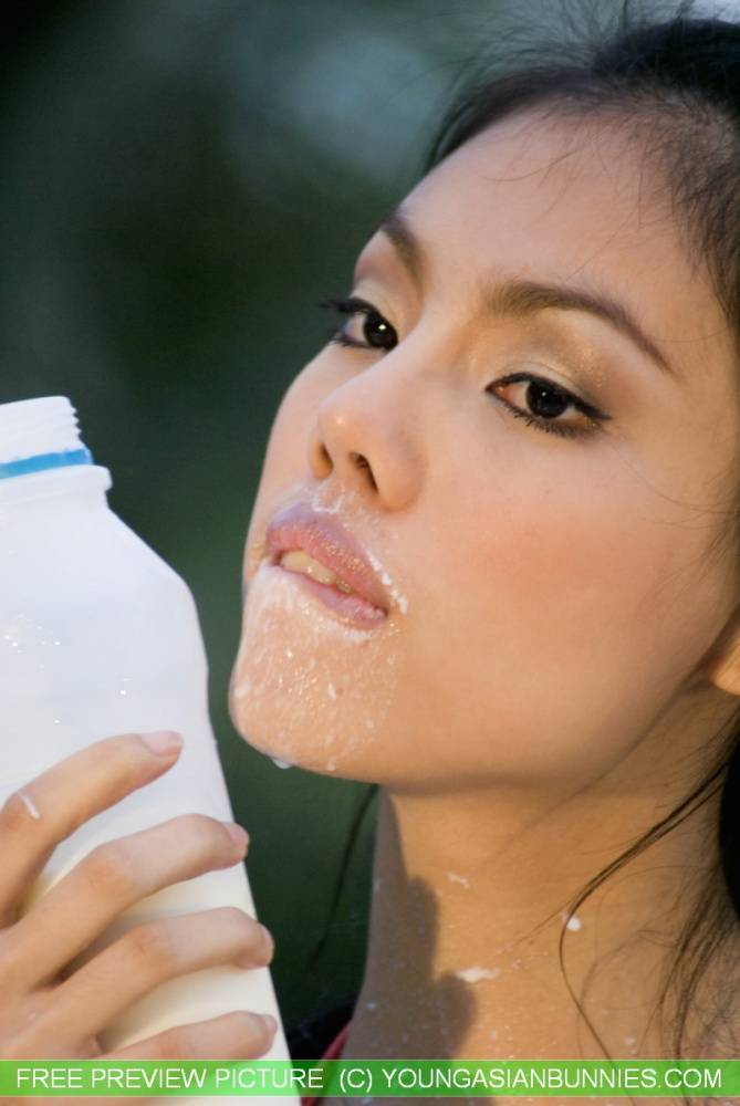 Sexy Asian girl gets milk all over her pretty face and nice breasts - #8