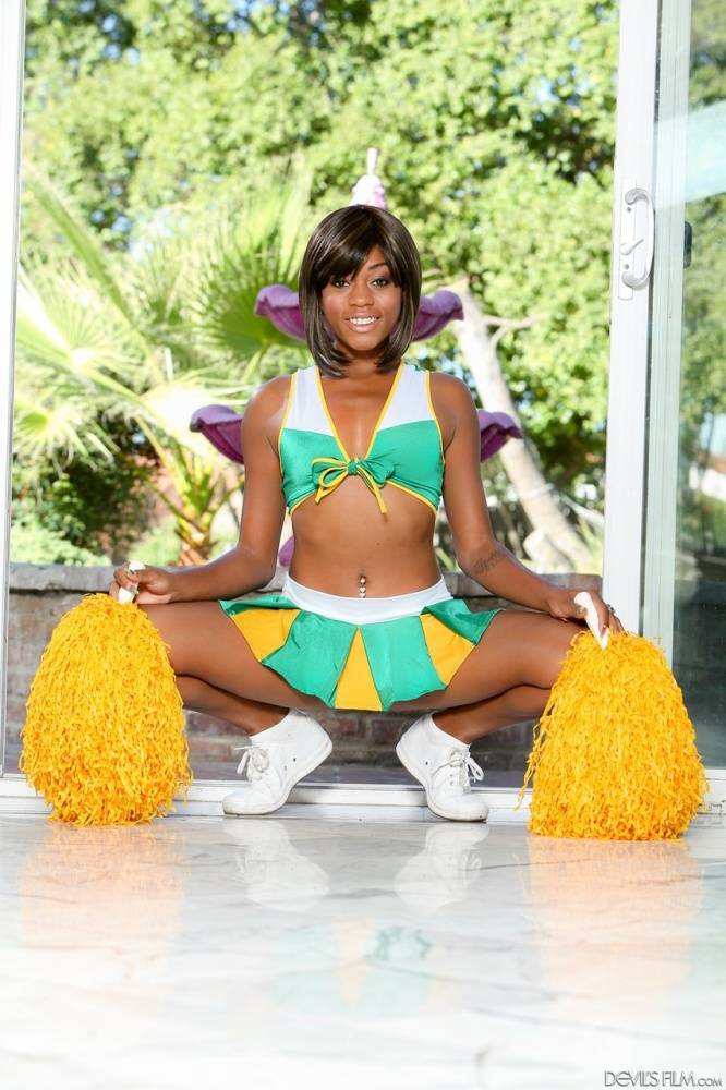 Sexy ebony cheerleader Karma May parts her pussy lips after baring her boobs - #2