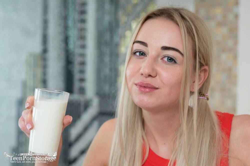 Busty blonde teen Iva gets bare naked over a big glass of milk - #1