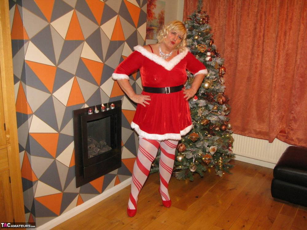 Blonde BBW Chrissy Uk shows her big ass and boobs by a Christmas tree - #6