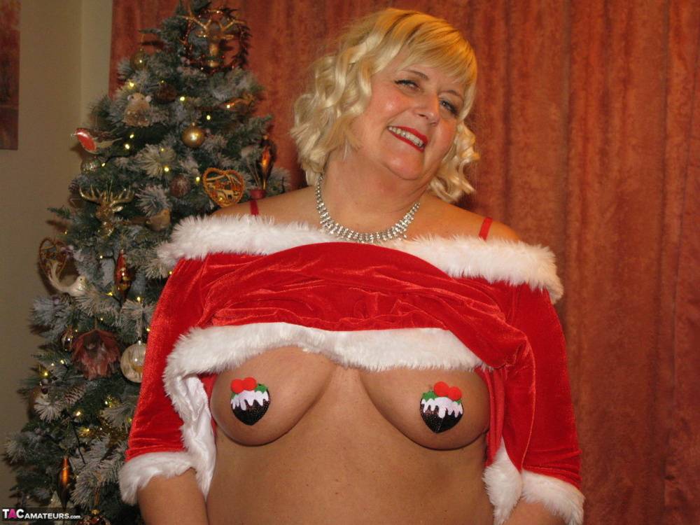 Blonde BBW Chrissy Uk shows her big ass and boobs by a Christmas tree - #10