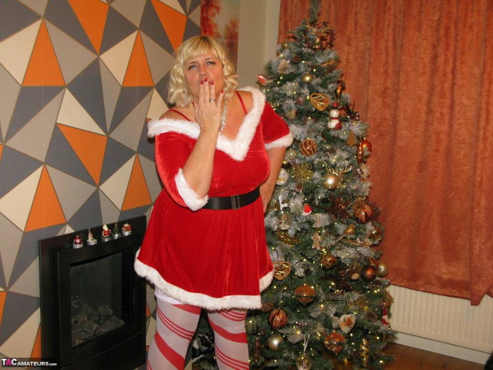 Blonde BBW Chrissy Uk shows her big ass and boobs by a Christmas tree - #11