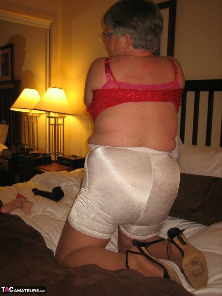 Fat granny Girdle Goddess whips out her big boobs on a bed in pantyhose - #9