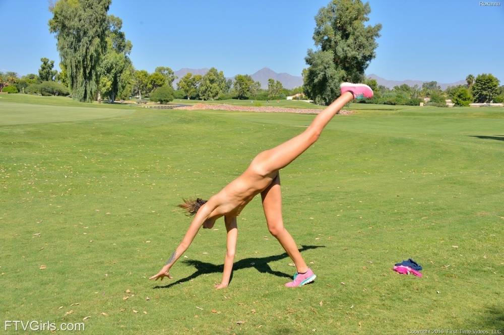 Fit brunette doing some exercise completely naked in public - #7