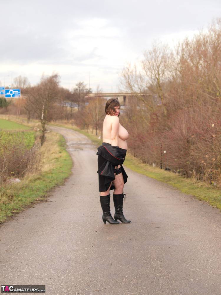 Overweight woman Roxy exposes herself while walking a path in black boots - #3