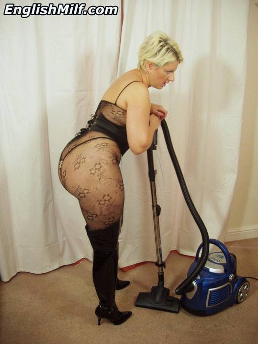 Curvylicious housewife Daniella English vacuuming in fishnets and black boots - #16
