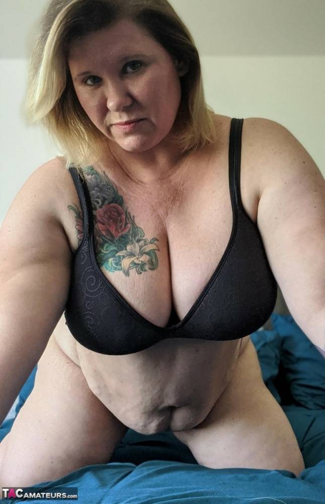 Older BBW Kris Ann takes self shots of her large tits during solo action - #13