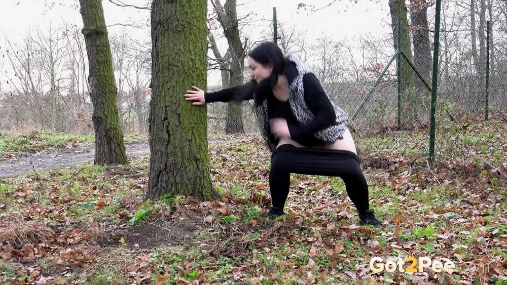 Fat chick Dora Black squats behind a tree to take a piss - #4