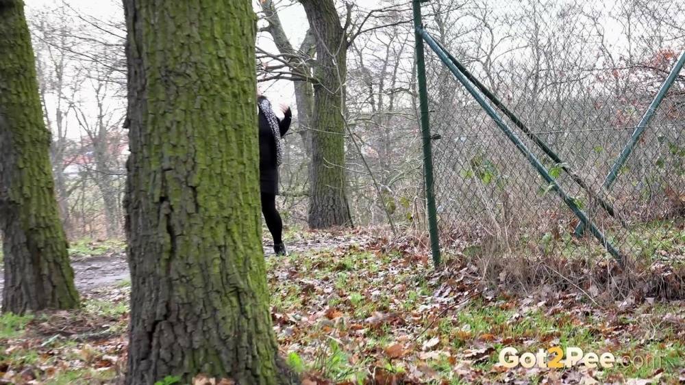 Fat chick Dora Black squats behind a tree to take a piss - #12