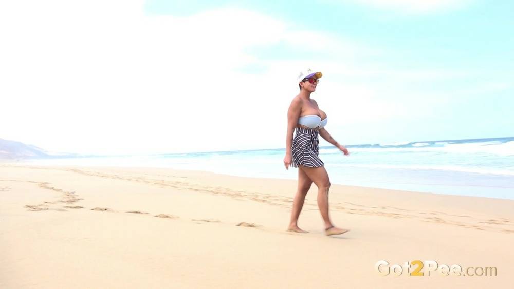 Caucasian female Chloe takes a piss while while traipsing on a deserted beach - #4