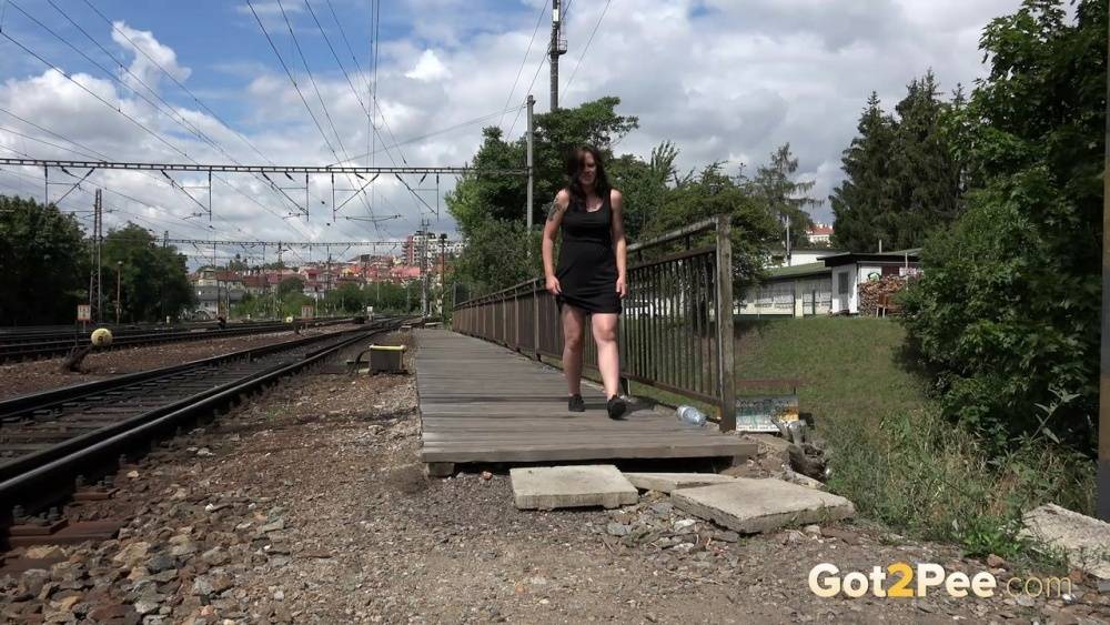 Thick woman Samy squats for a piss at the end of a railway station platform - #7