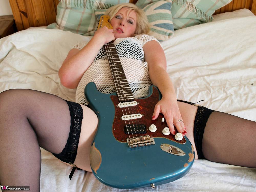 Blonde BBW Samantha touches her pussy while holding an electric guitar - #10