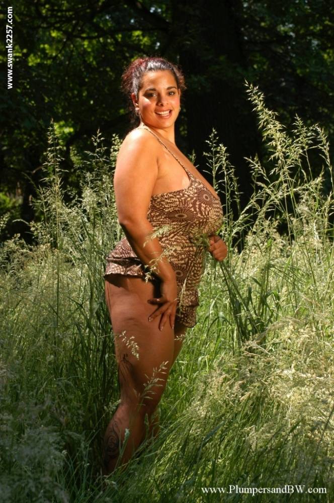 Fat girl licks a nipple while getting naked while getting naked in long grass - #13