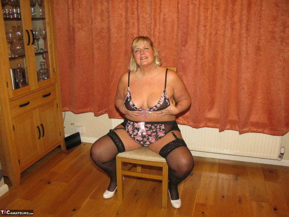 Mature fatty Chrissy Uk uncups her tits before showing her twat in nylons - #9