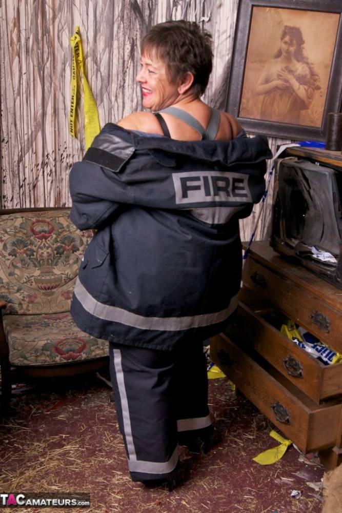 Mature fatty doffs her firefighter clothing to show her twat in stockings - #5