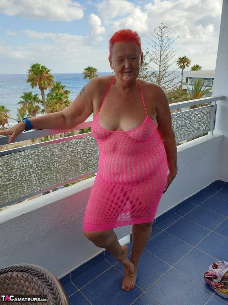 Fat nan with short red hair finger spreads her pussy on oceanside balcony - #10