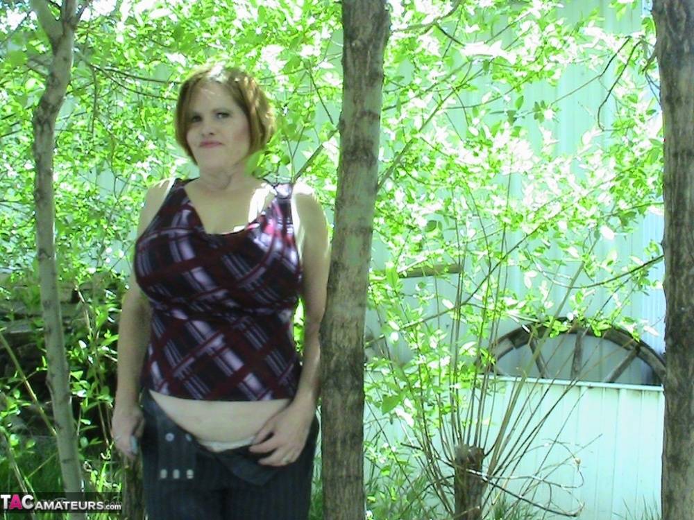 Thick older woman Misha MILF exposes herself in a stand of hardwood trees - #11