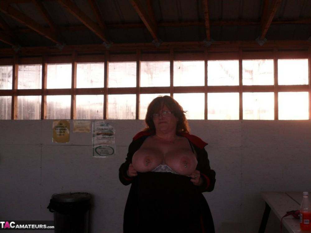 Overweight redhead Misha MILF exposes her tits & twat inside a building - #4