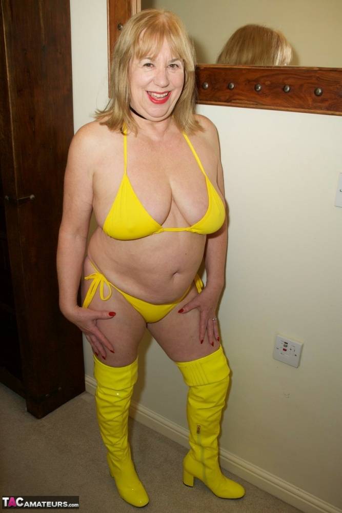 Aged lady Speedy Bee doffs a yellow bikini to masturbate in matching boots - #11
