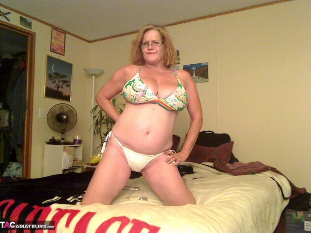 Busty Middle-aged amateur Misha MILF rides a dildo on her bed in glasses - #1