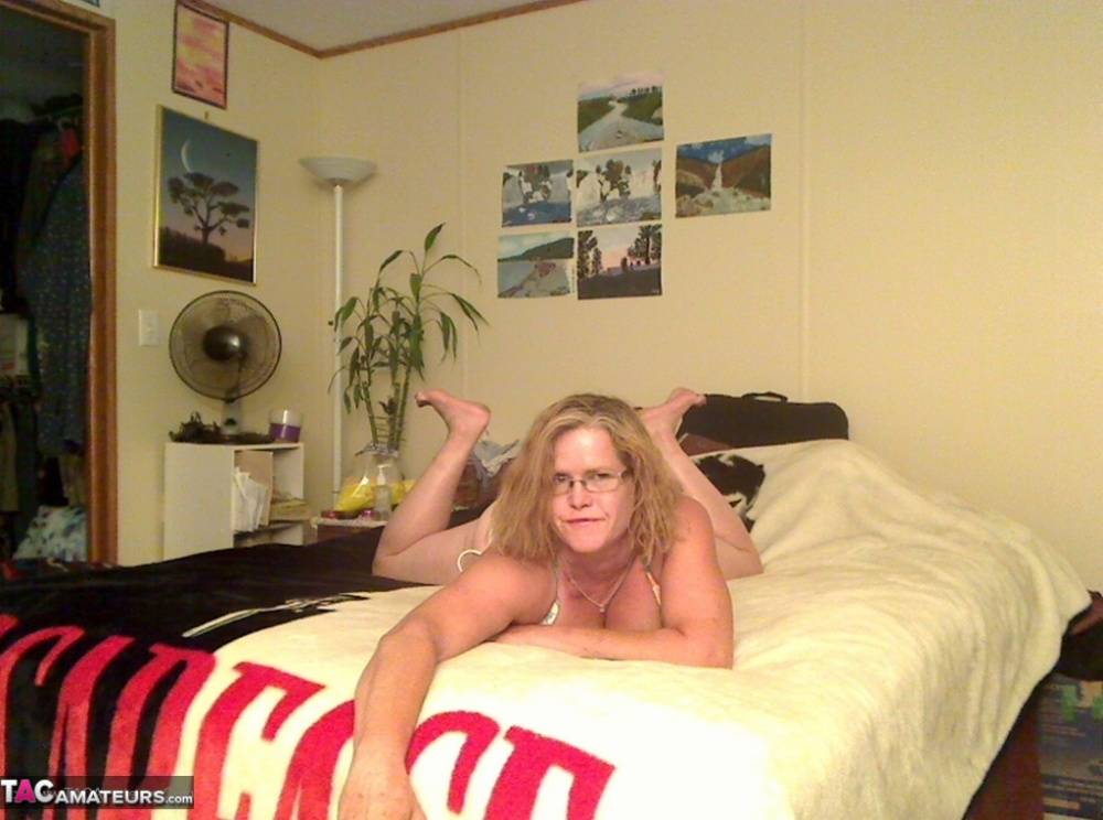 Busty Middle-aged amateur Misha MILF rides a dildo on her bed in glasses - #16