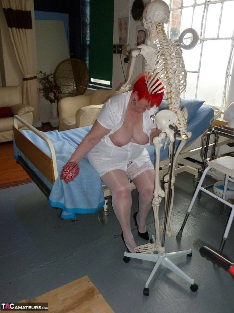 Older redhead nurse Valgasmic Exposed gets banged by a dildo wielding skeleton - #15