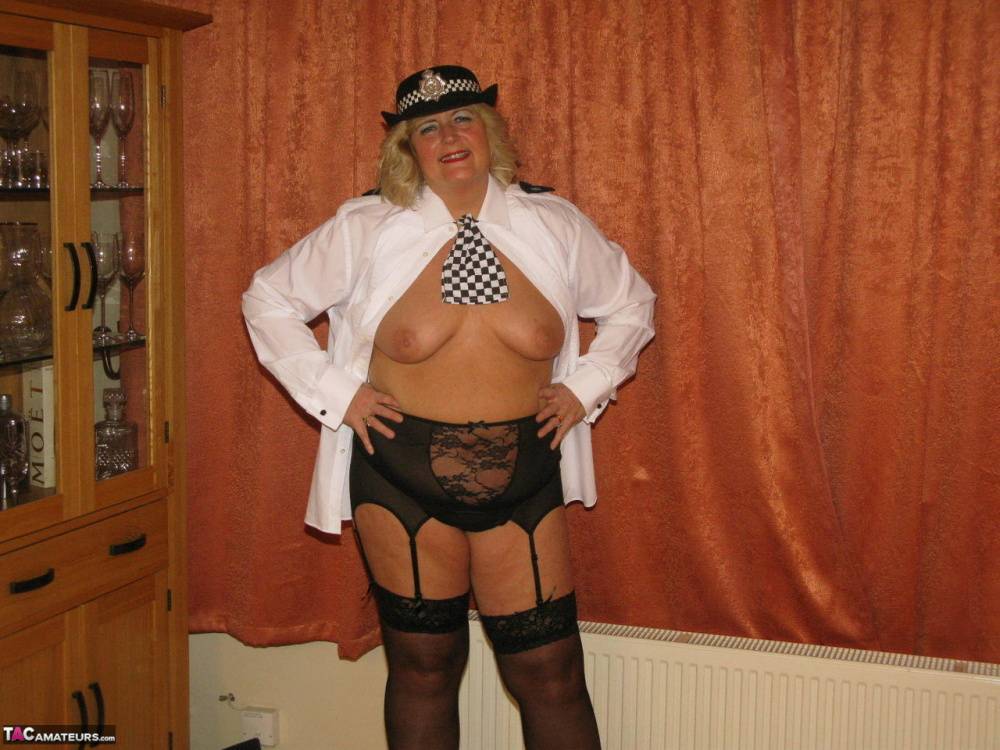 Mature policewoman Chrissy Uk looses her tits and twat from her uniform - #1