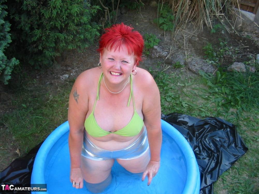 Older redheaded BBW Valgasmic Exposed plays with a dildo in a wading pool - #7