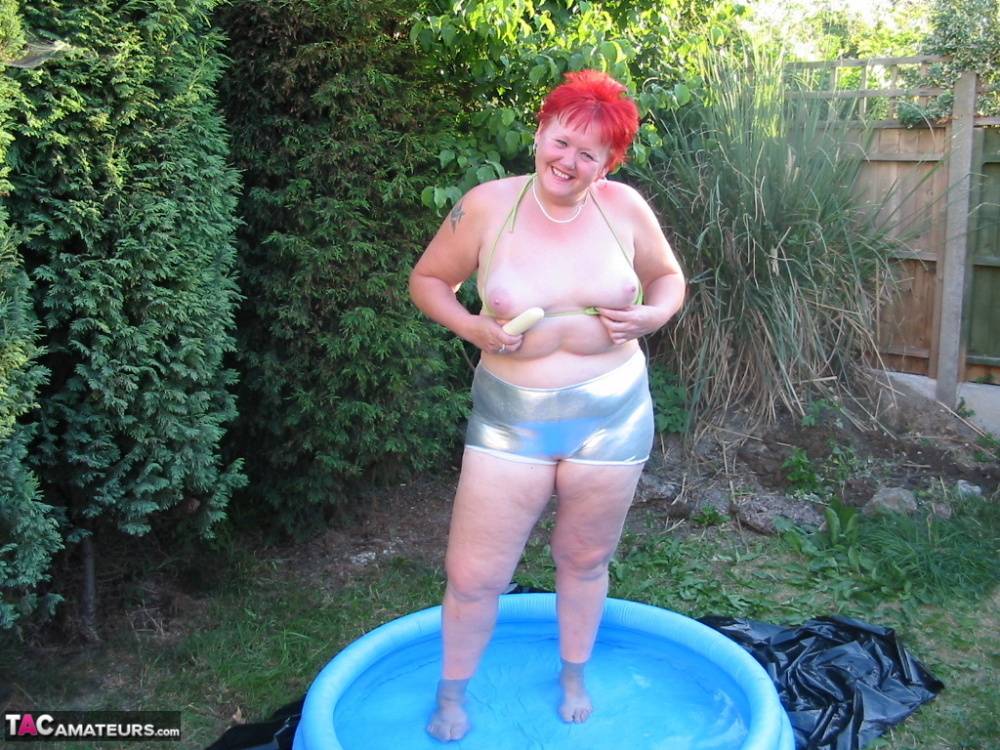 Older redheaded BBW Valgasmic Exposed plays with a dildo in a wading pool - #8
