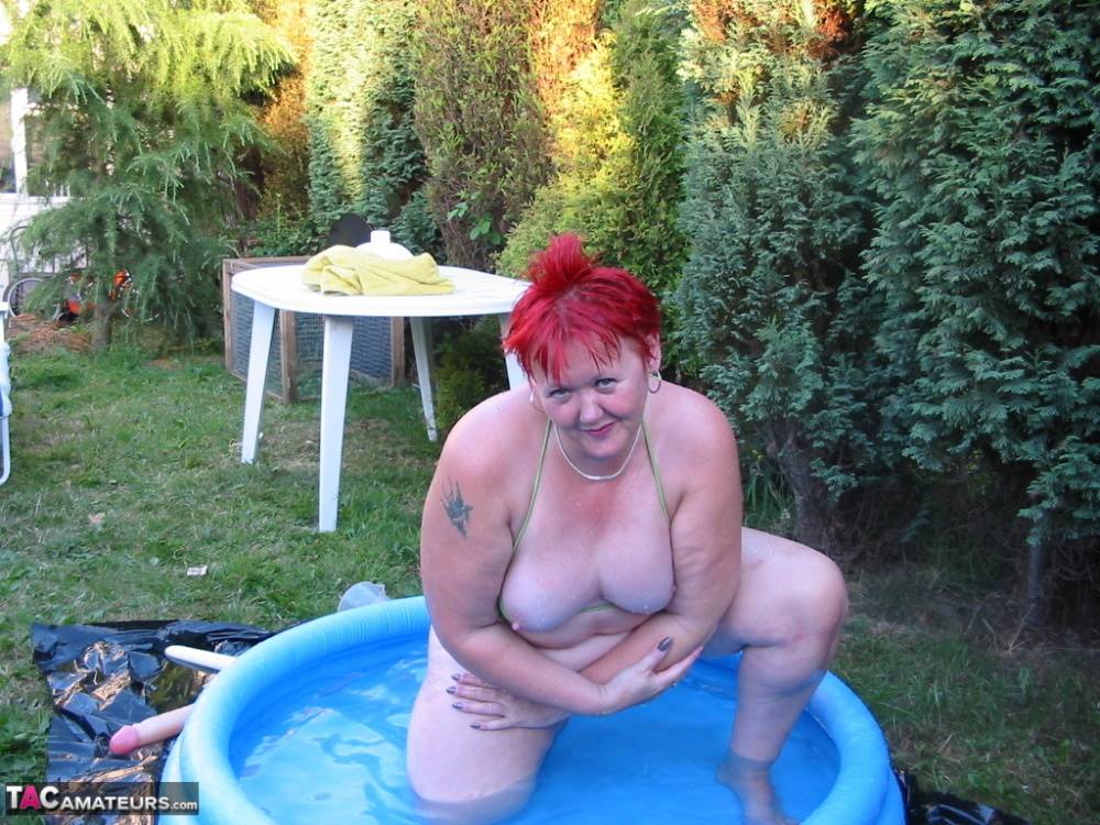 Older redheaded BBW Valgasmic Exposed plays with a dildo in a wading pool - #3