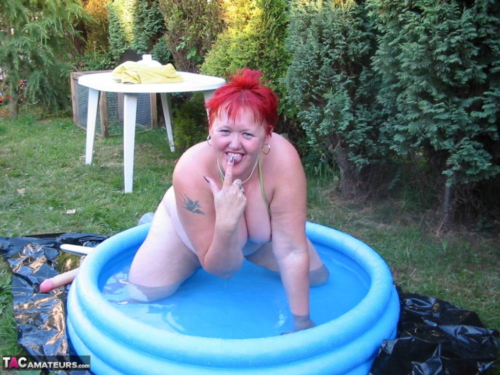 Older redheaded BBW Valgasmic Exposed plays with a dildo in a wading pool - #10