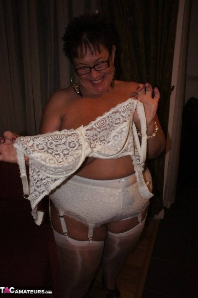 Older BBW Warm Sweet Honey sets her large tits free in hose and girdle panties - #6