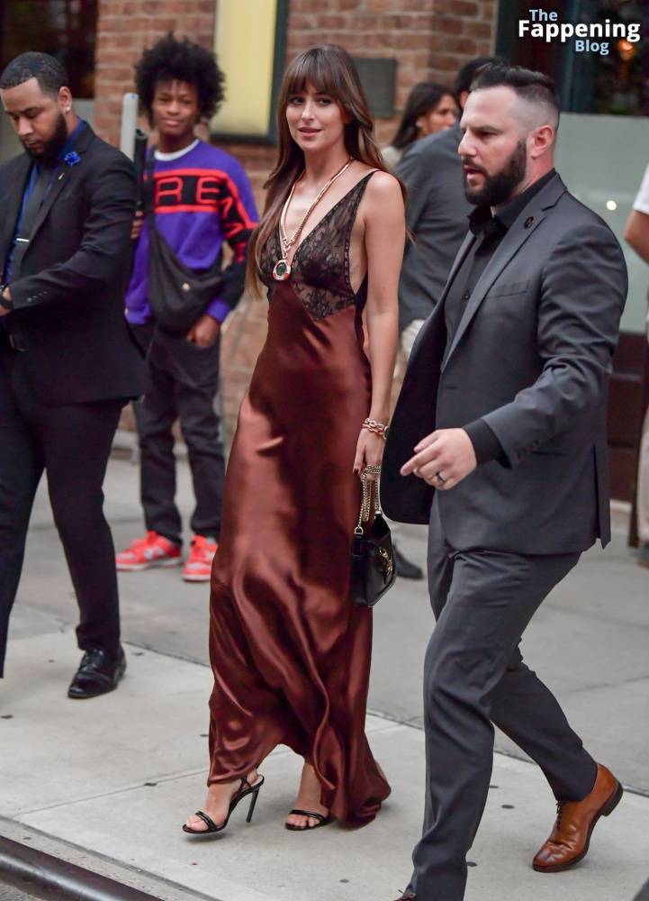 Dakota Johnson Stuns in a Copper Silk Gown Leaving Her Hotel in NYC (29 Photos) - #25