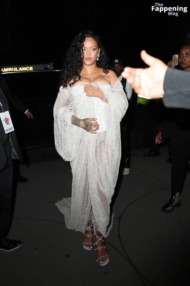 Rihanna Displays Her Curves in a White Dress (13 Photos) - #11