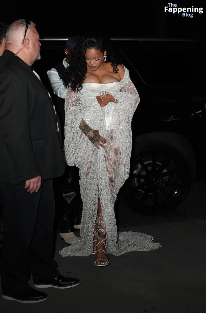 Rihanna Displays Her Curves in a White Dress (13 Photos) - #4