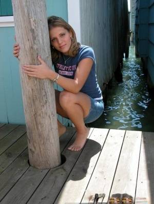 Blonde solo girl flashes upskirt panties on lakeside boardwalk - #main