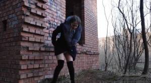 Distressed girl Nastya pulls down her tights to pee by an abandoned building on amateurlikes.com