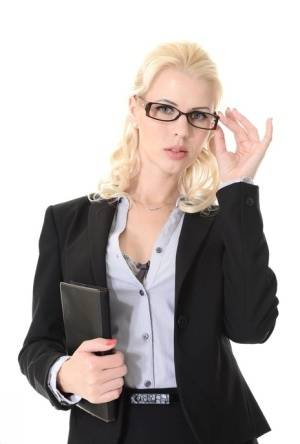 Blonde businesswoman Ms Lynna takes off her glasses while stripping naked on amateurlikes.com