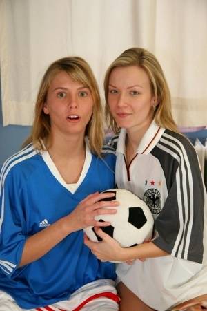 Cute teen girls go lesbian after trying on soccer outfits on a bed on amateurlikes.com