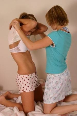 Young amateur Karen & Amy enjoy undressing each other & kissing in underwear on amateurlikes.com