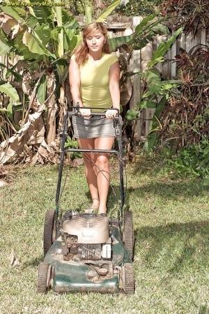 Curvy May Malani gets horny mowing the lawn so she gets naked. on amateurlikes.com