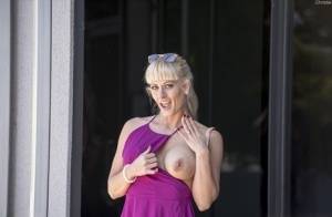 Naughty blonde flashes no panty upskirts and her big tits out in public on amateurlikes.com