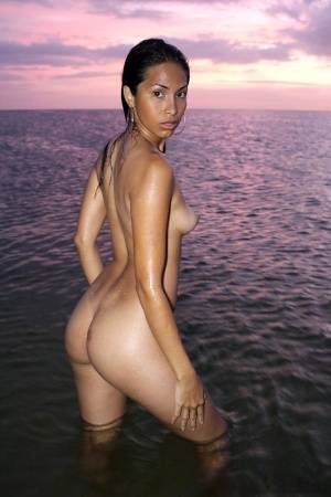 Latina model Ruth Medina poses nude for a solo shoot at the beach on amateurlikes.com