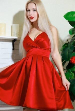 Nice blonde teen Genevieve Gandi removes red dress to display her trimmed muff on amateurlikes.com